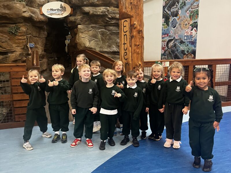 Group of happy children at an aquarium
