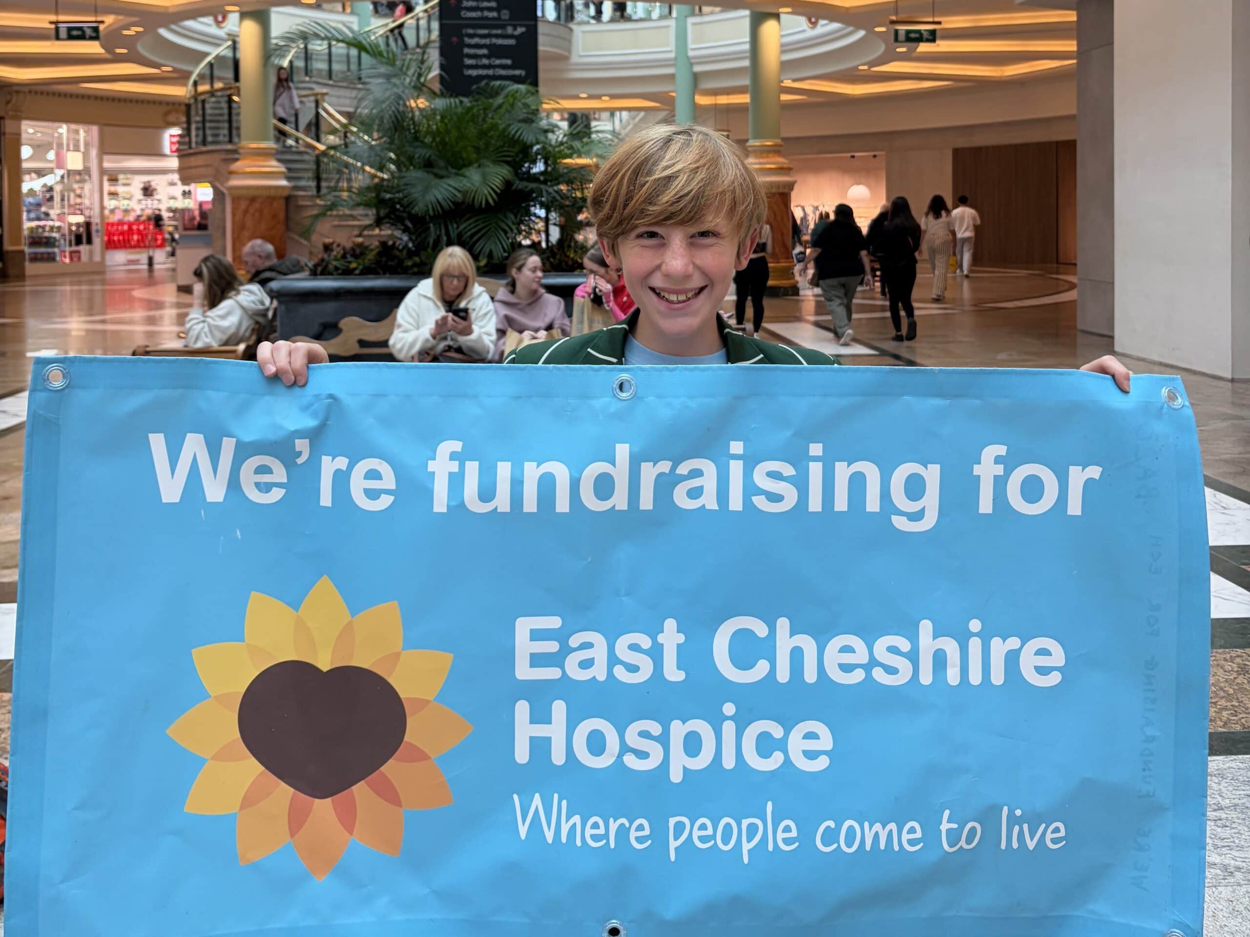 Boy with fundraising banner