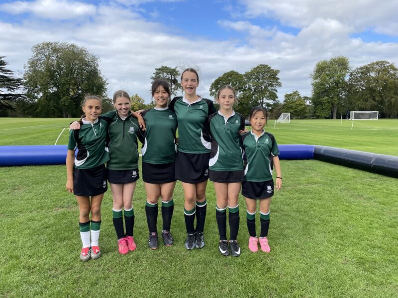 Team of girls about to play football