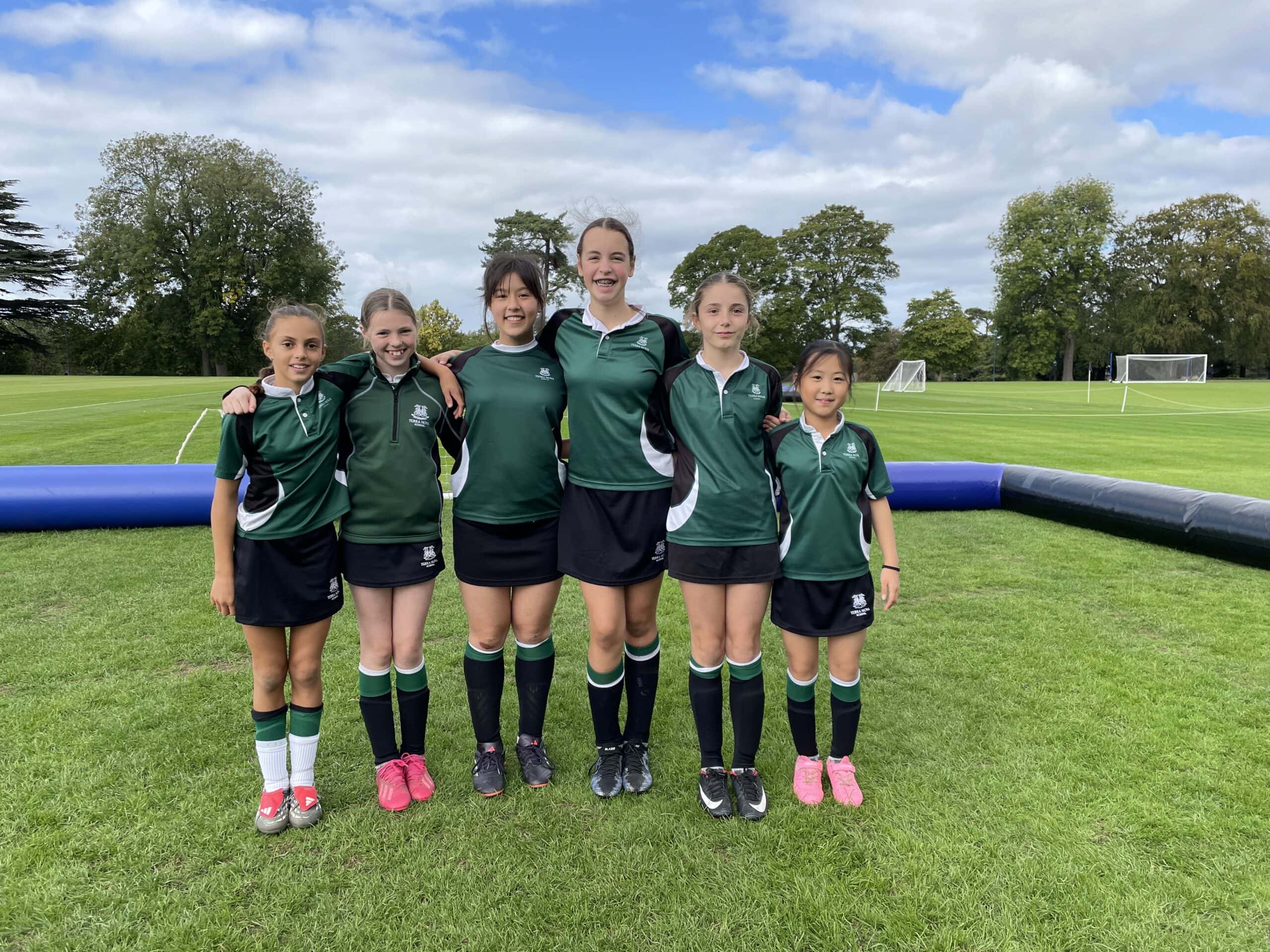Team of girls about to play football