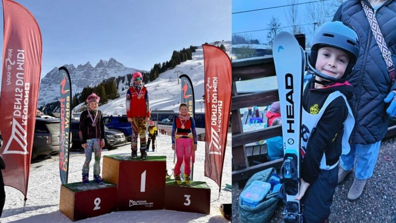 Young skiers standing on winners' podium