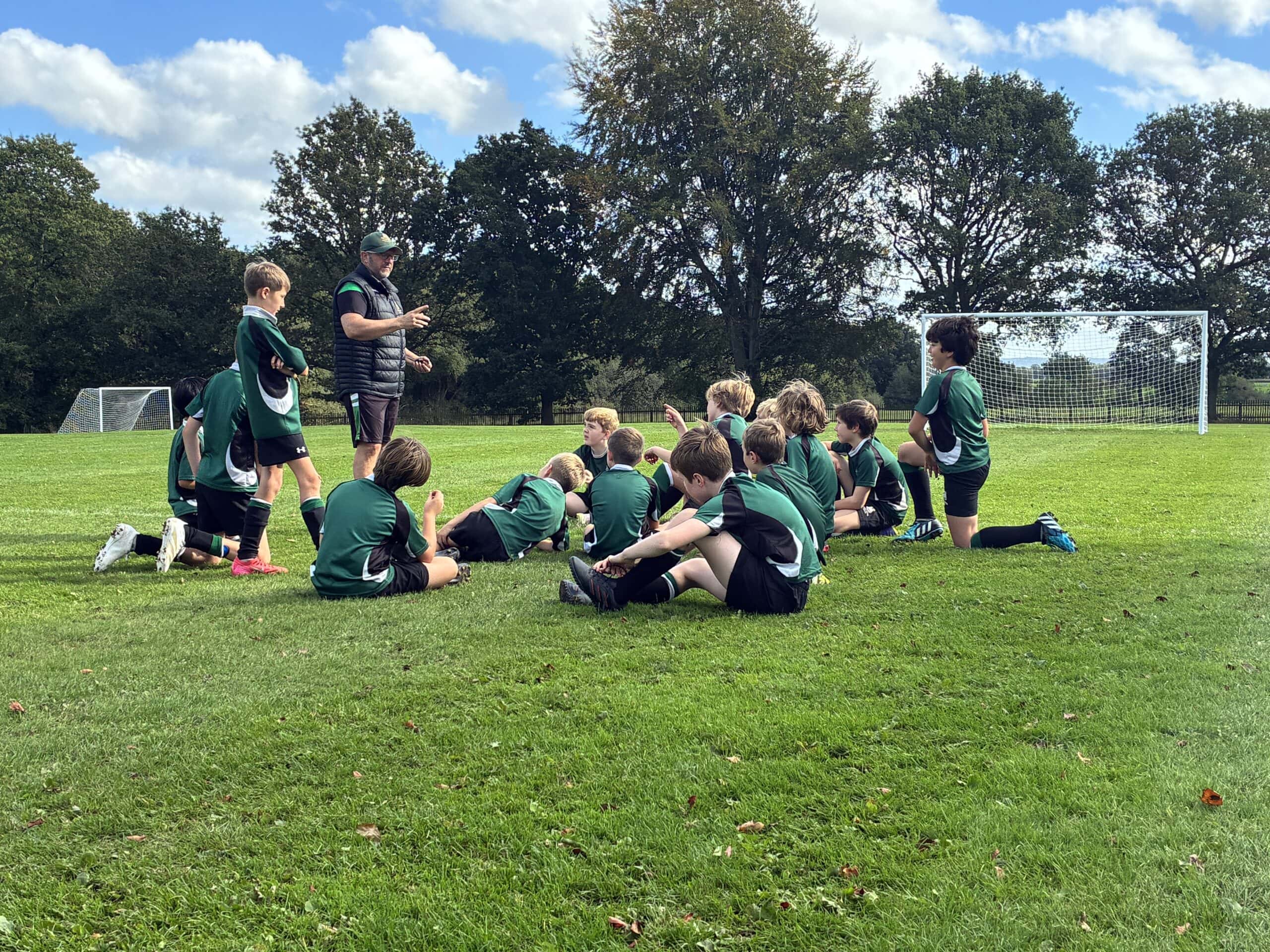 Boys' football team with coach