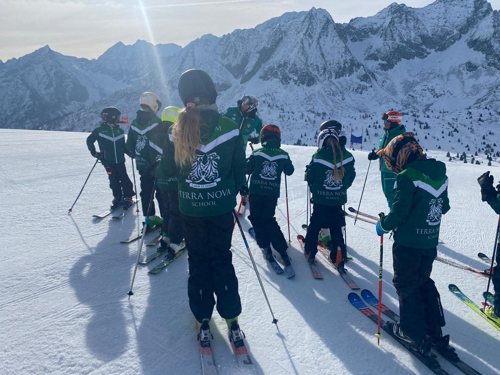 Group of children in Terra Nova ski gear with stunning mountainous background