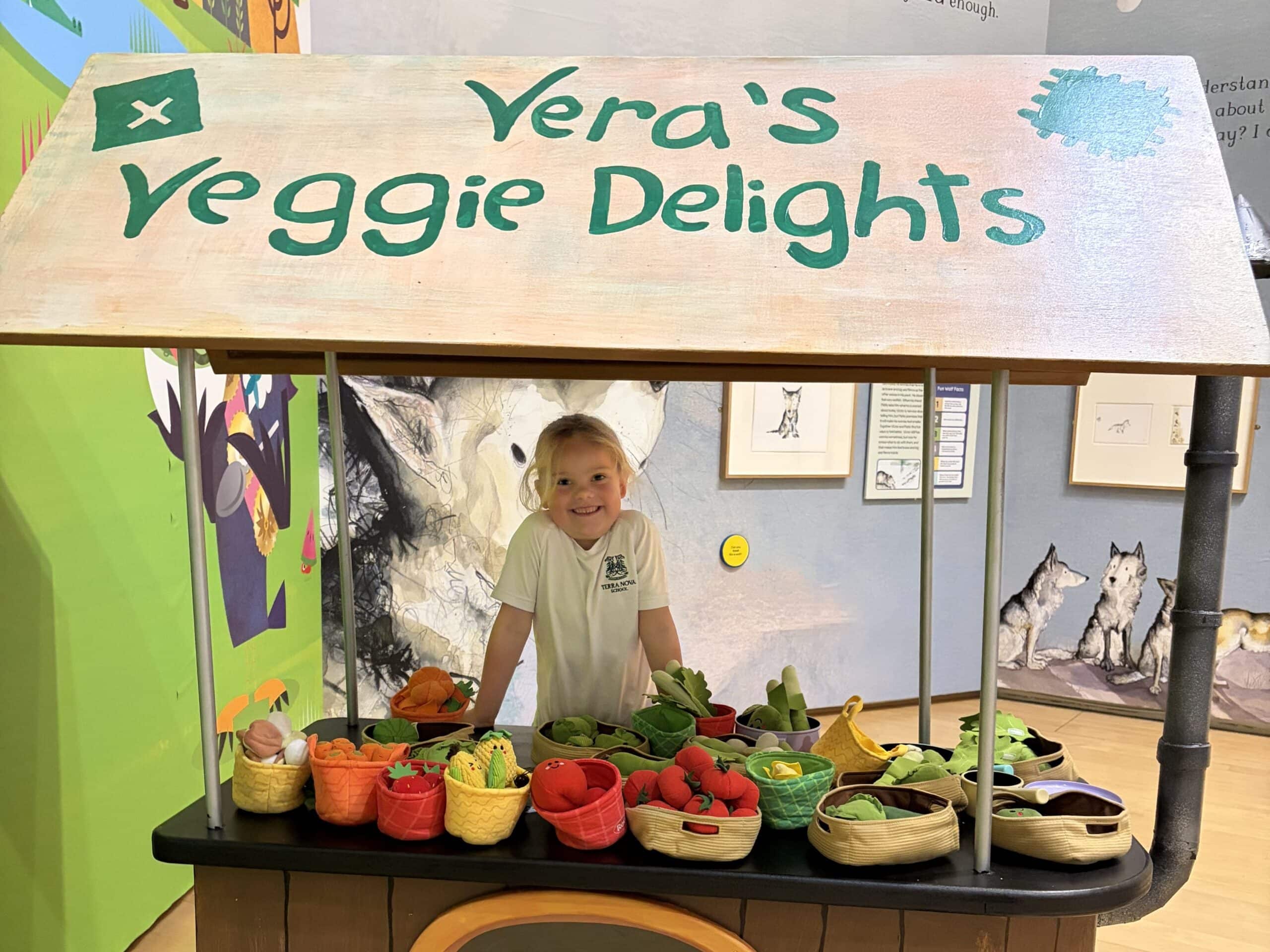 Young girl at vegetable stand