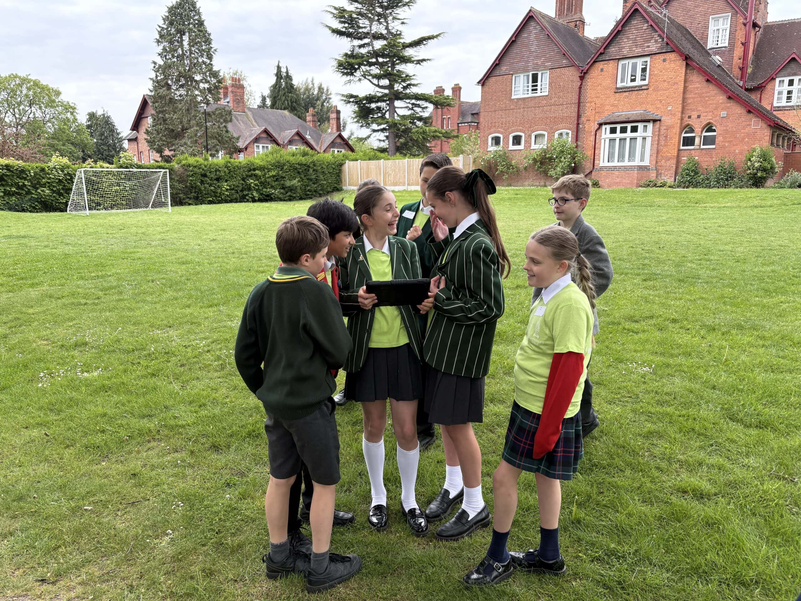 Children filming a movie outside
